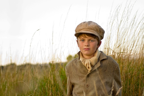 Alfie Lewis as Young Pip in a publicity still